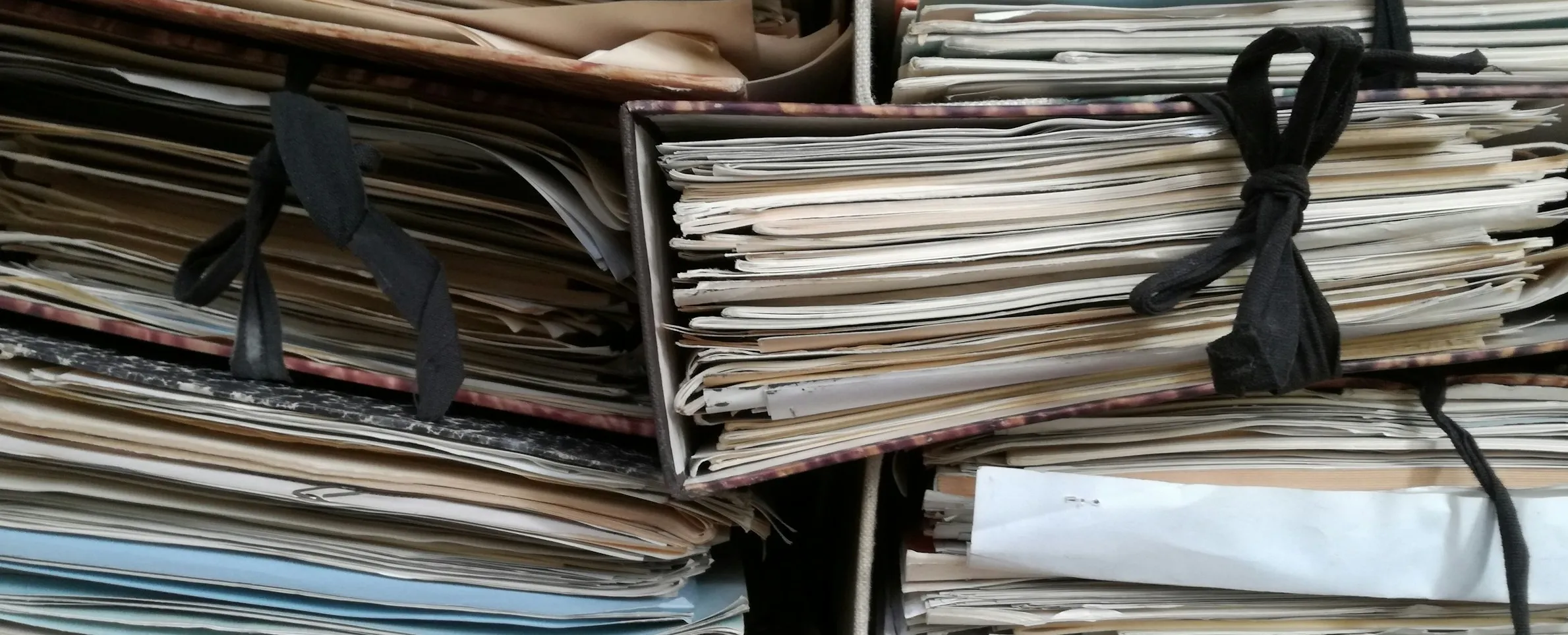 Untidy stacks of binders containging unread resumes of your competitors.